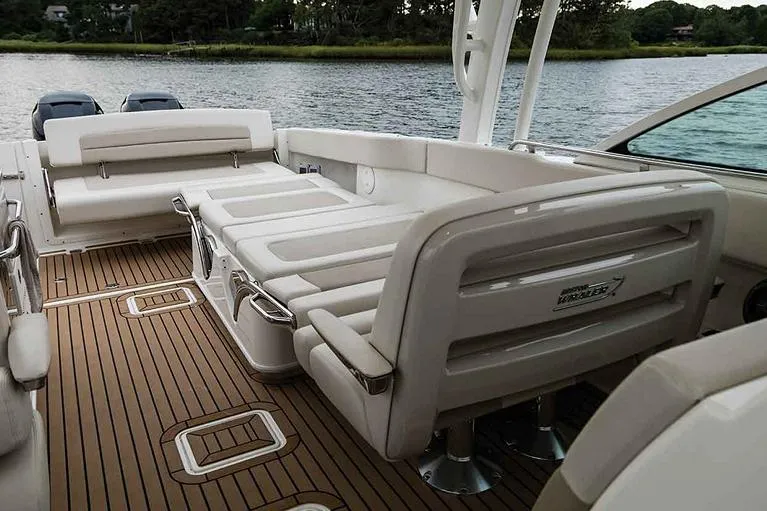 Slide: The Image of Manufacturer Provided Image: 2022 Boston Whaler 320 Vantage boat interior with seating and teak flooring. - 13