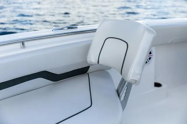 Slide: The Image of 2023 Wellcraft 222 Fisherman boat interior with white cushioned seating. - 11