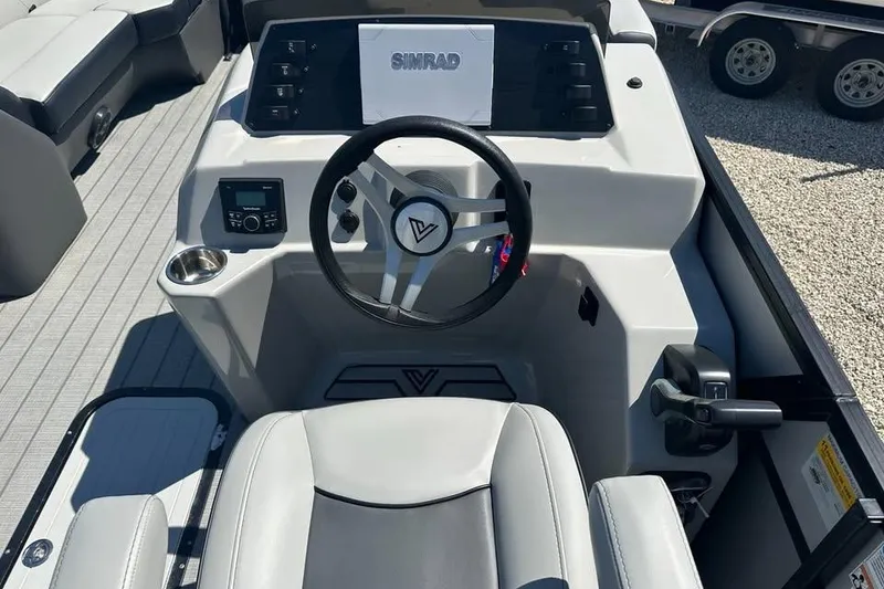Slide: The Image of 2023 Viaggio Lago X-R 22 boat cockpit with steering wheel and control panel. - 7