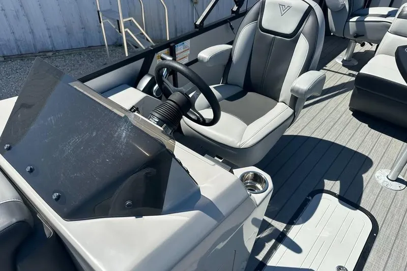Slide: The Image of Captain's seat and helm of 2023 Viaggio Lago X-R 22 boat, featuring modern design. - 8