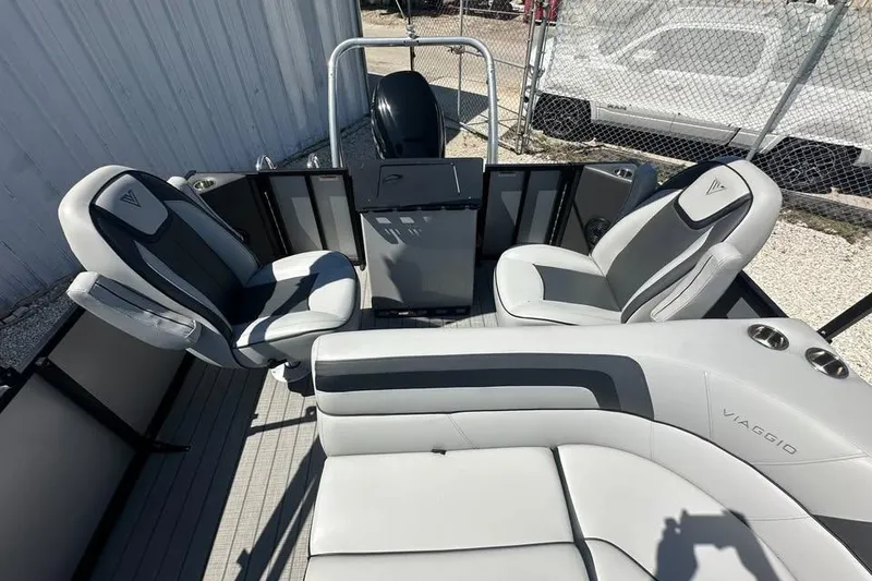 Slide: The Image of 2023 Viaggio Lago X-R 22 boat interior with modern seating and sleek design. - 9