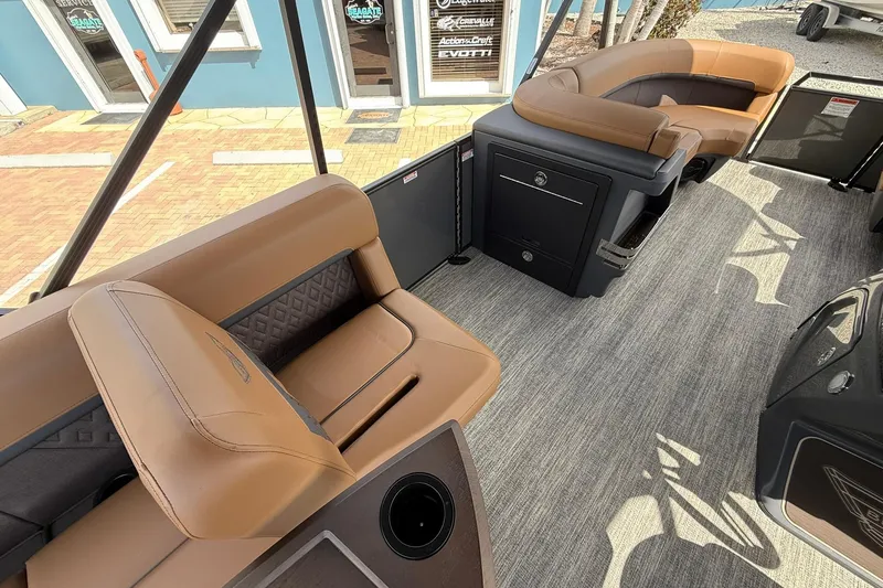 Slide: The Image of 2026 Bennington 24 M Fish and Cruise boat interior with tan seating and modern design. - 12