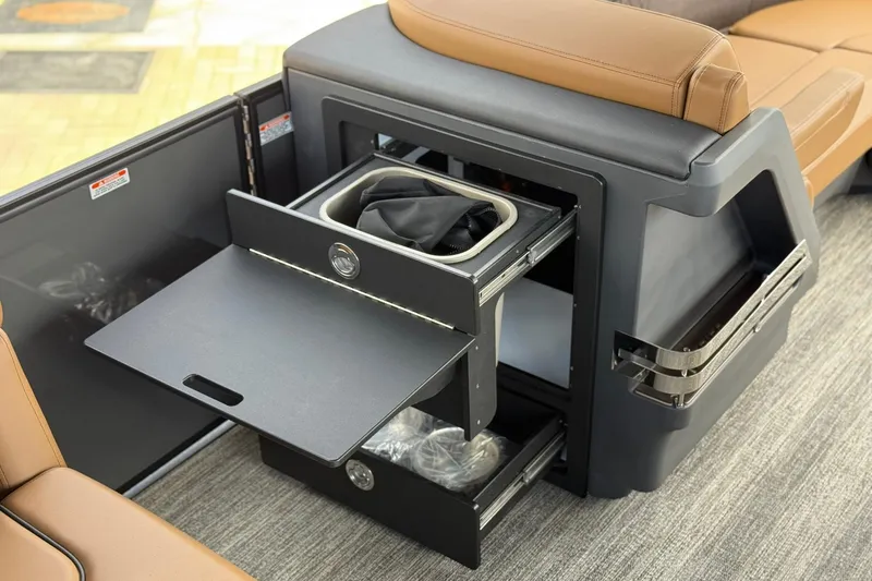 Slide: The Image of 2026 Bennington 24 M Fish and Cruise boat interior with storage compartments and seating. - 13