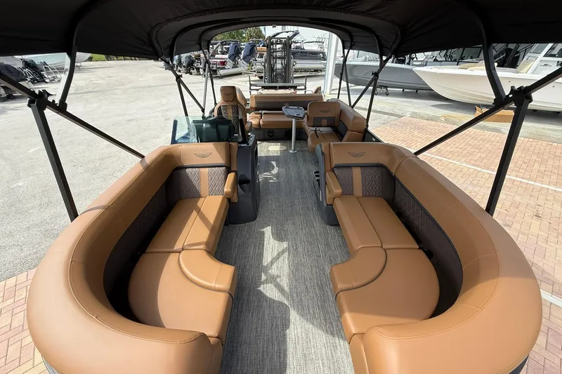 Slide: The Image of 2026 Bennington 24 M Fish and Cruise pontoon boat with luxurious seating and canopy. - 17