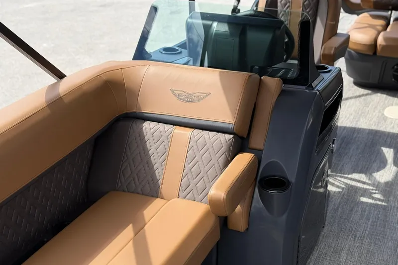 Slide: The Image of Luxurious seating on the 2026 Bennington 24 M Fish and Cruise boat, featuring elegant upholstery. - 18