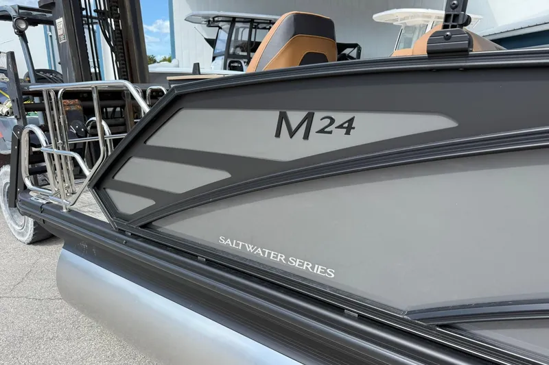 Slide: The Image of 2026 Bennington 24 M Fish and Cruise pontoon, Saltwater Series, side view. - 2
