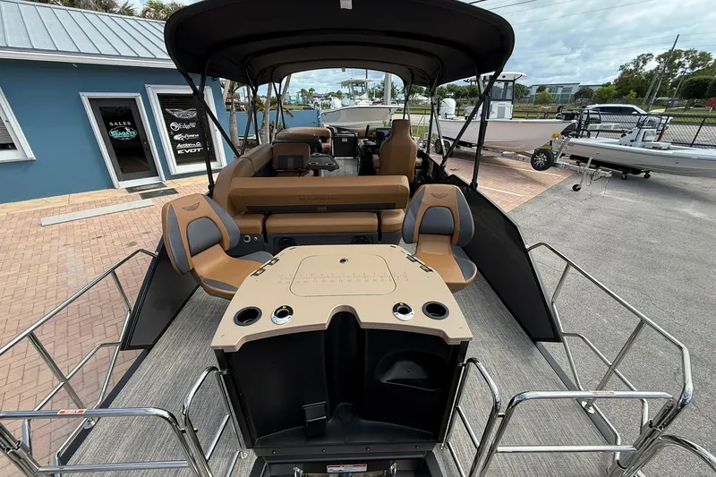 Slide: The Image of 2026 Bennington 24 M Fish and Cruise pontoon boat with spacious seating and modern design. - 3