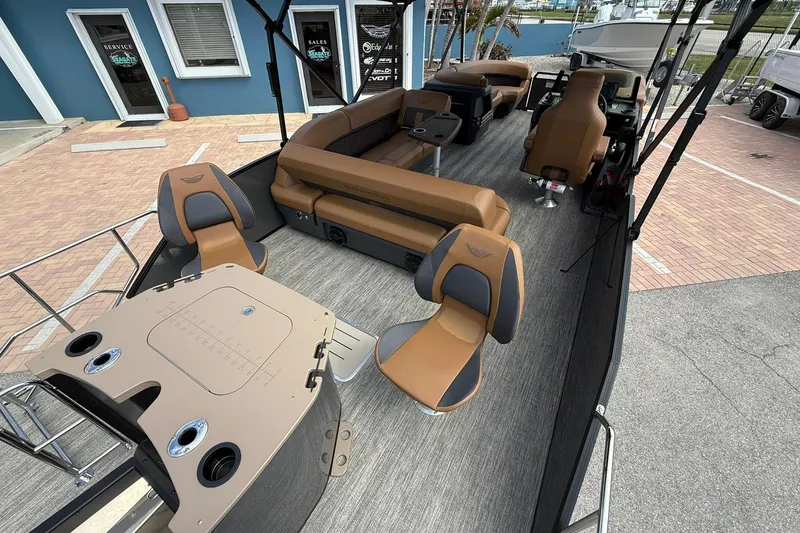 Slide: The Image of 2026 Bennington 24 M Fish and Cruise pontoon boat interior with seating and helm. - 4