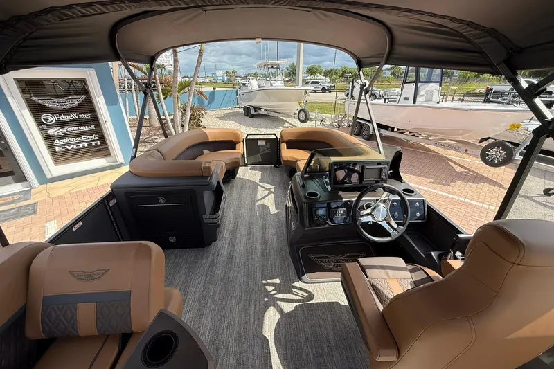 Slide: The Image of 2026 Bennington 24 M Fish and Cruise boat interior with luxurious seating and modern dashboard. - 9