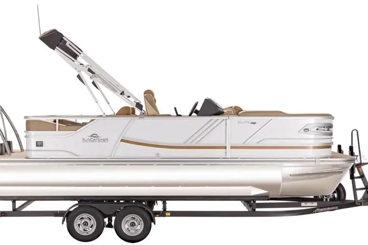 Slide: The Image of 2026 SunCatcher Elite 322SR pontoon boat on trailer, featuring sleek design and modern amenities. - 6