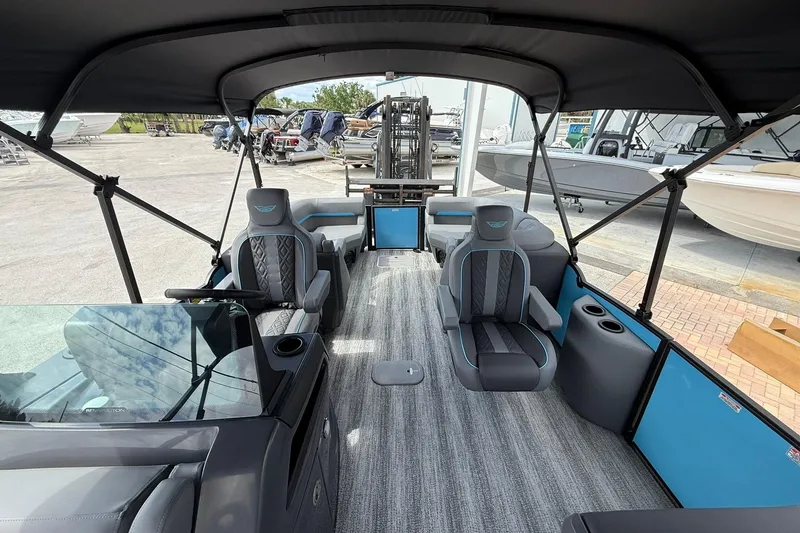 Slide: The Image of Interior of 2026 Bennington 26 M Quad Bench pontoon boat, featuring luxurious seating and modern design. - 10