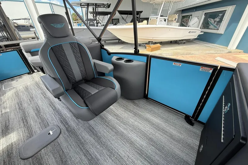 Slide: The Image of Luxurious interior of 2026 Bennington 26 M Quad Bench pontoon boat with plush seating. - 11