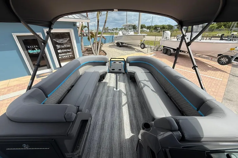 Slide: The Image of 2026 Bennington 26 M Quad Bench pontoon boat with spacious seating and modern design. - 13