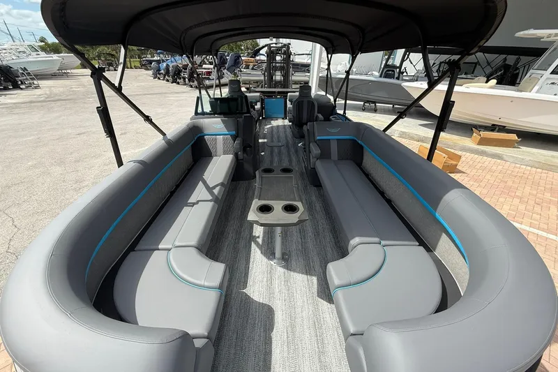 Slide: The Image of 2026 Bennington 26 M Quad Bench pontoon boat with spacious seating and modern design. - 14