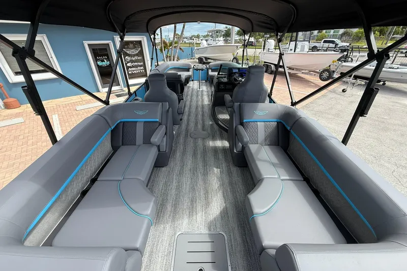 Slide: The Image of 2026 Bennington 26 M Quad Bench boat interior with spacious seating and modern design. - 4