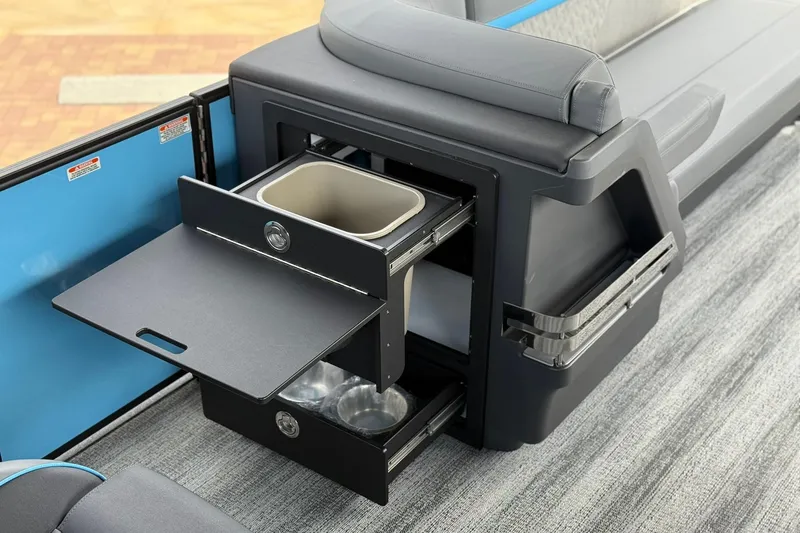 Slide: The Image of 2026 Bennington 26 M Quad Bench with pull-out storage and seating features. - 7