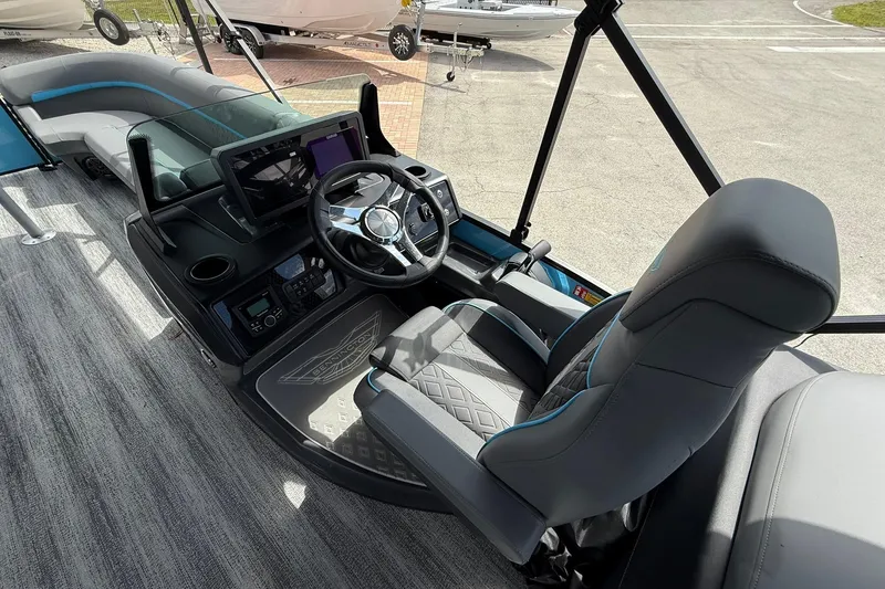 Slide: The Image of 2026 Bennington 26 M Quad Bench boat interior with modern helm and seating. - 8