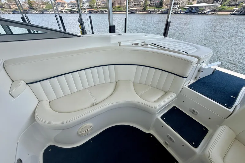 Slide: The Image of Luxurious seating area on a 2003 Cobalt 282 boat, overlooking a serene waterfront. - 10