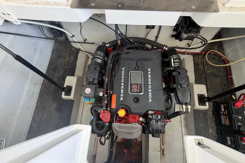 Slide: The Image of Engine compartment of a 2003 Cobalt 282 boat featuring a Volvo Penta 8.1 Gi engine. - 25
