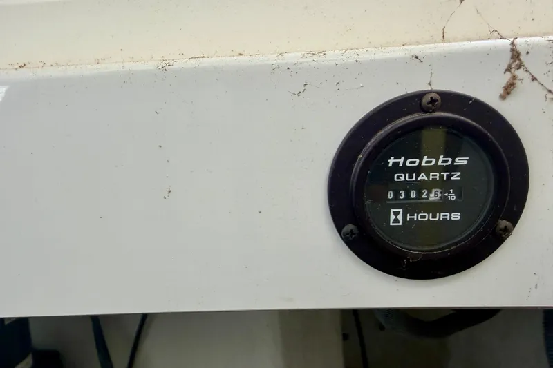 Slide: The Image of Hobbs quartz hour meter on 2003 Cobalt 282 boat, displaying 3026.1 hours. - 26