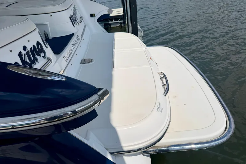 Slide: The Image of 2003 Cobalt 282 boat with swim platform on calm water. - 5