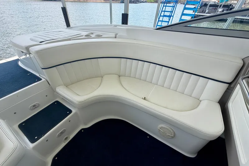 Slide: The Image of Luxurious white seating on a 2003 Cobalt 282 boat, overlooking serene waters. - 9