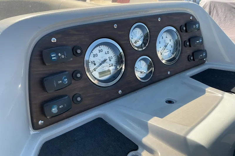 Slide: The Image of Dashboard of 2018 Manitou 23 Aurora LE RF boat with gauges and switches. - 10