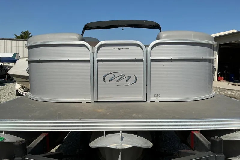 Slide: The Image of 2018 Manitou 23 Aurora LE RF pontoon boat, silver exterior, parked outdoors. - 3