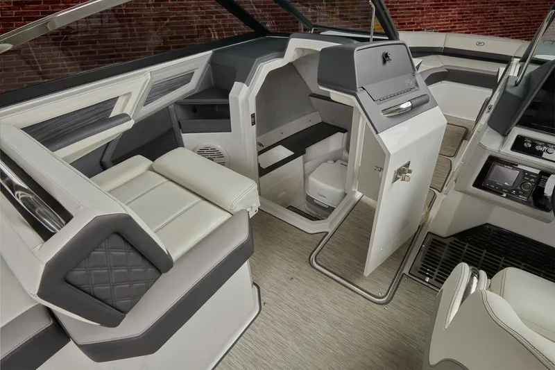 Slide: The Image of 2026 Cobalt R6 Outboard boat interior bathroom with sink and toilet. - 19