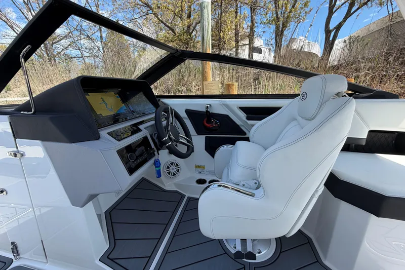 Slide: The Image of 2026 Cobalt R6 Outboard dashboard with dual Garmin displays and navigation controls. - 24