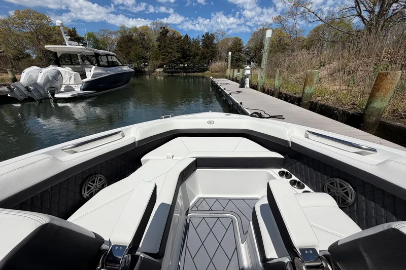 Slide: The Image of 2026 Cobalt R6 Outboard boat interior with luxurious seating and cup holders. - 30