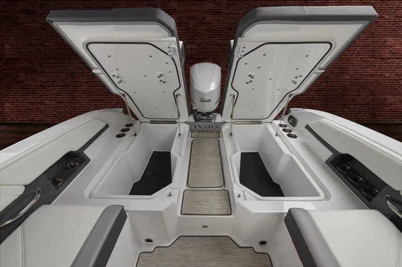 Slide: The Image of 2026 Cobalt R6 Outboard boat with open storage compartments and sleek interior design. - 4