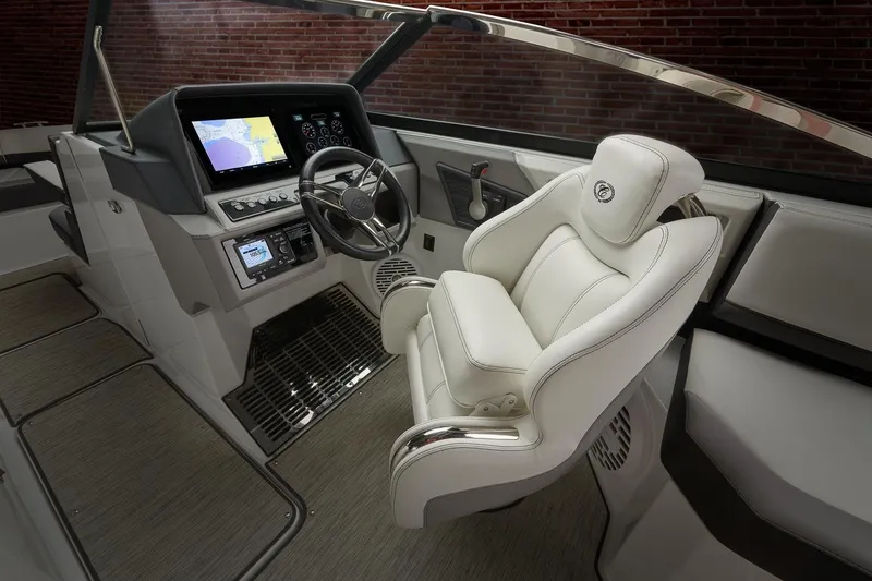 Slide: The Image of 2026 Cobalt R6 Outboard boat cockpit with modern steering and navigation system. - 9