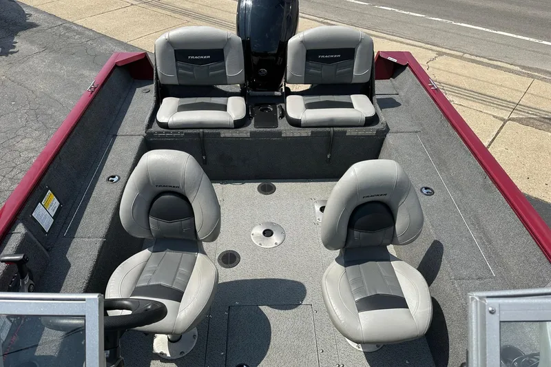 Slide: The Image of 2018 Tracker Pro Guide V-175 Combo boat interior with four gray seats. - 5