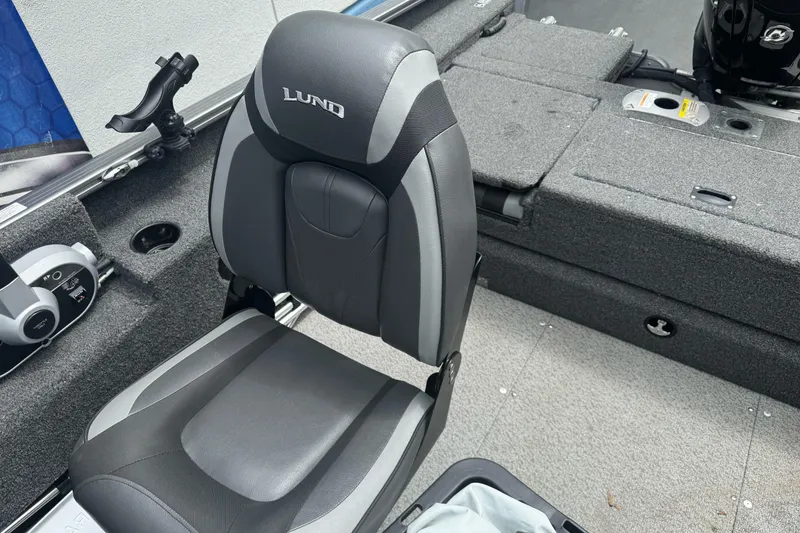 Slide: The Image of 2019 Lund 1675 Adventure Sport boat interior with gray seating and fishing rod holder. - 15