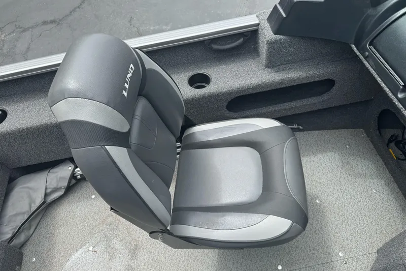 Slide: The Image of 2019 Lund 1675 Adventure Sport boat seat, gray and black upholstery, interior view. - 16