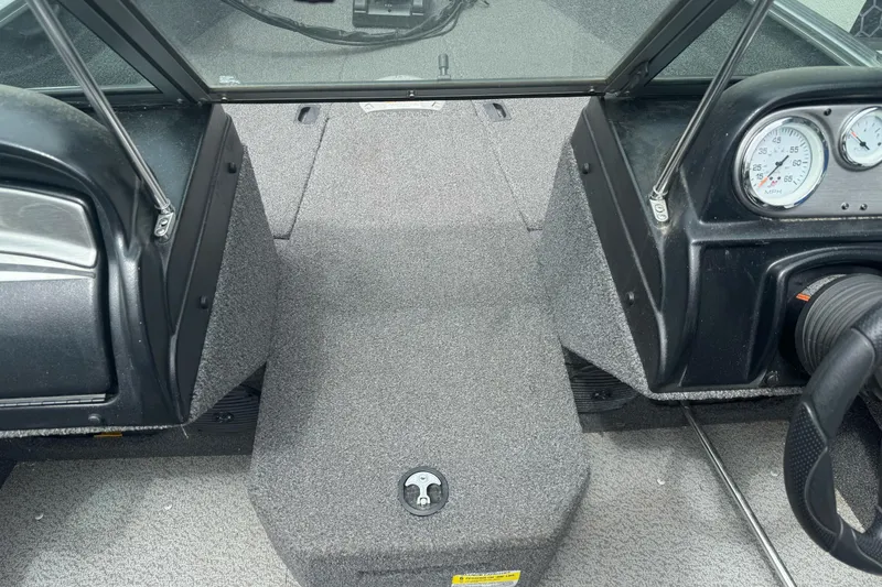 Slide: The Image of Interior view of 2019 Lund 1675 Adventure Sport boat dashboard and seating area. - 19