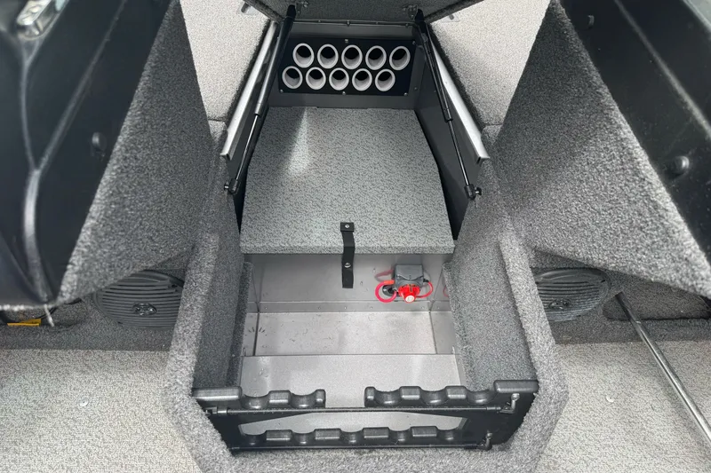 Slide: The Image of 2019 Lund 1675 Adventure Sport boat interior storage compartment with rod holders. - 20