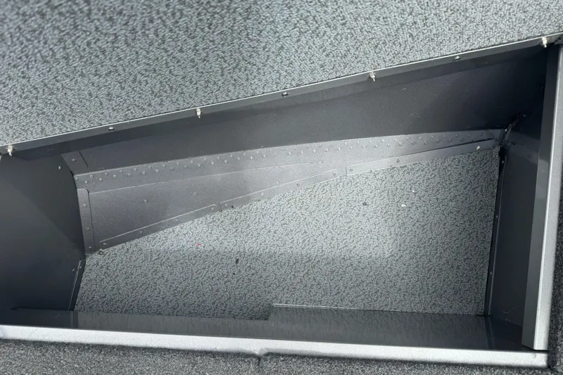Slide: The Image of Interior compartment of 2019 Lund 1675 Adventure Sport boat, featuring textured flooring. - 23
