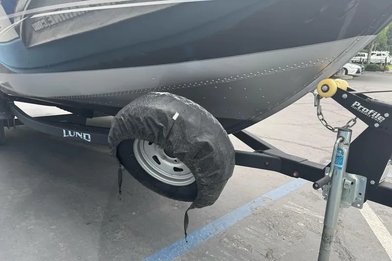 Slide: The Image of 2019 Lund 1675 Adventure Sport boat on trailer with covered wheel. - 7
