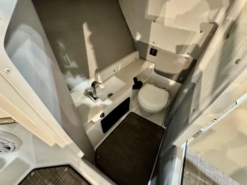 Slide: The Image of 2025 Cobalt R8 Outboard interior bathroom with sink and toilet. - 14