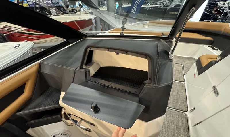 Slide: The Image of 2025 Cobalt R8 Outboard interior with open storage compartment and modern design. - 15