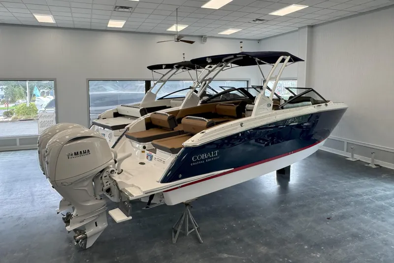 Slide: The Image of 2025 Cobalt R8 Outboard boat with Yamaha engines in showroom. - 2