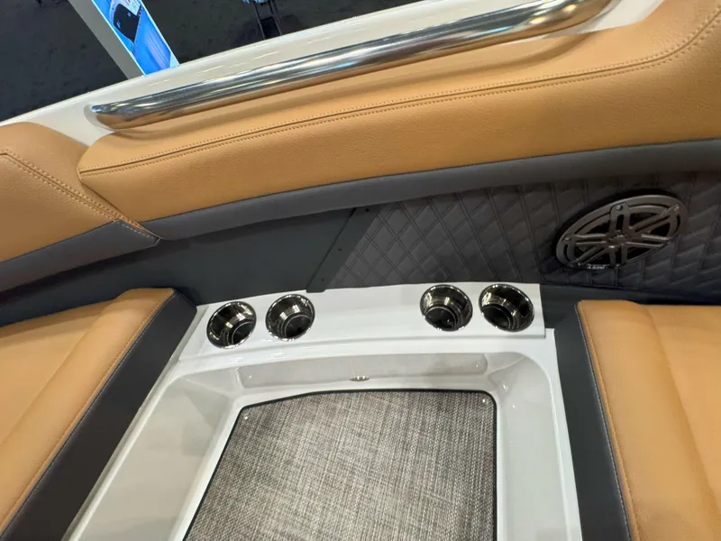 Slide: The Image of 2025 Cobalt R8 Outboard interior with tan leather seats and cup holders. - 21