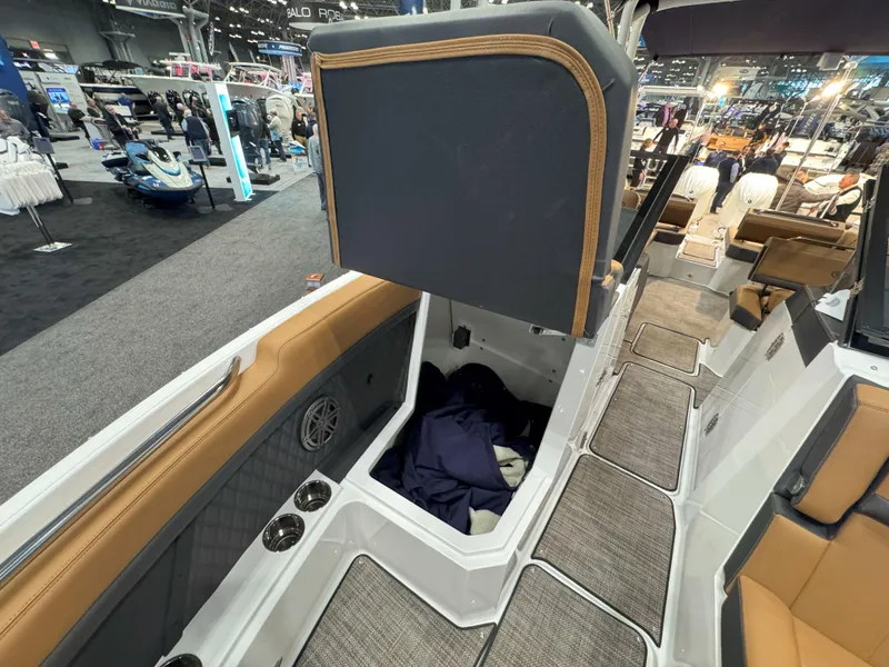 Slide: The Image of 2025 Cobalt R8 Outboard boat interior with open storage compartment and seating. - 23