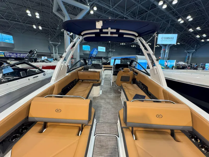 Slide: The Image of 2025 Cobalt R8 Outboard boat interior with tan seating and modern design. - 5