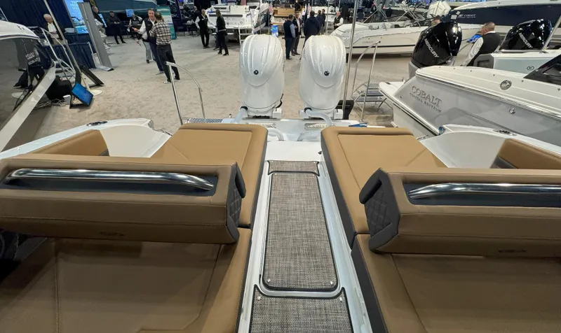 Slide: The Image of 2025 Cobalt R8 Outboard boat interior with twin engines at a boat show. - 6