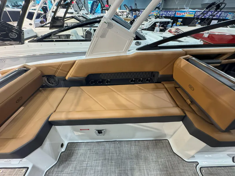 Slide: The Image of 2025 Cobalt R8 Outboard boat interior with tan seating and modern design. - 7
