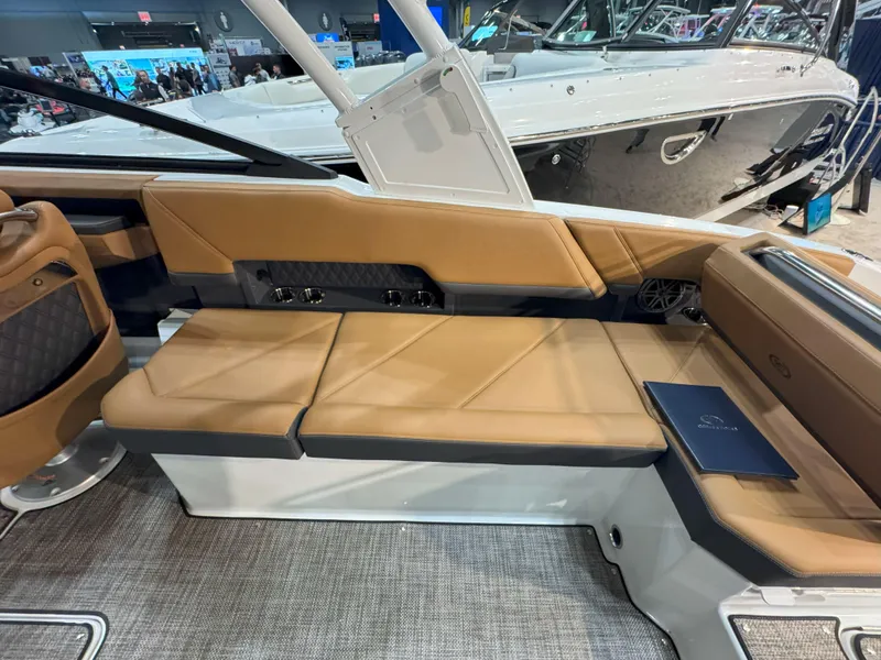 Slide: The Image of Luxurious interior of 2025 Cobalt R8 Outboard boat with tan seating and modern design. - 9