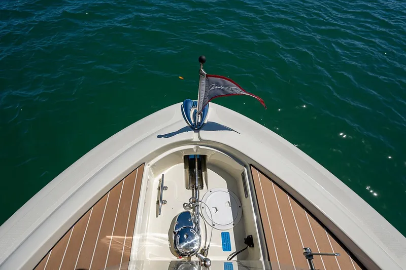 Slide: The Image of Bow of 2017 Chris-Craft Catalina 26 on clear blue water. - 12